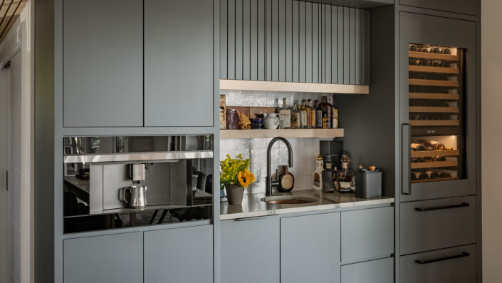 ARS Construction: Custom grey kitchen bar with wine fridge and coffee maker.